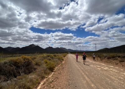 ladies walking along an open gravel road