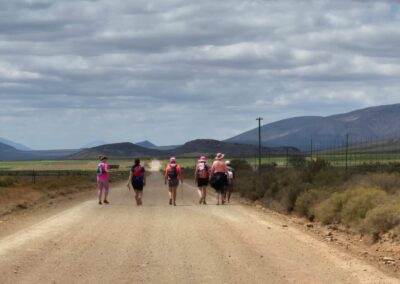 ladies walking on open gravel road